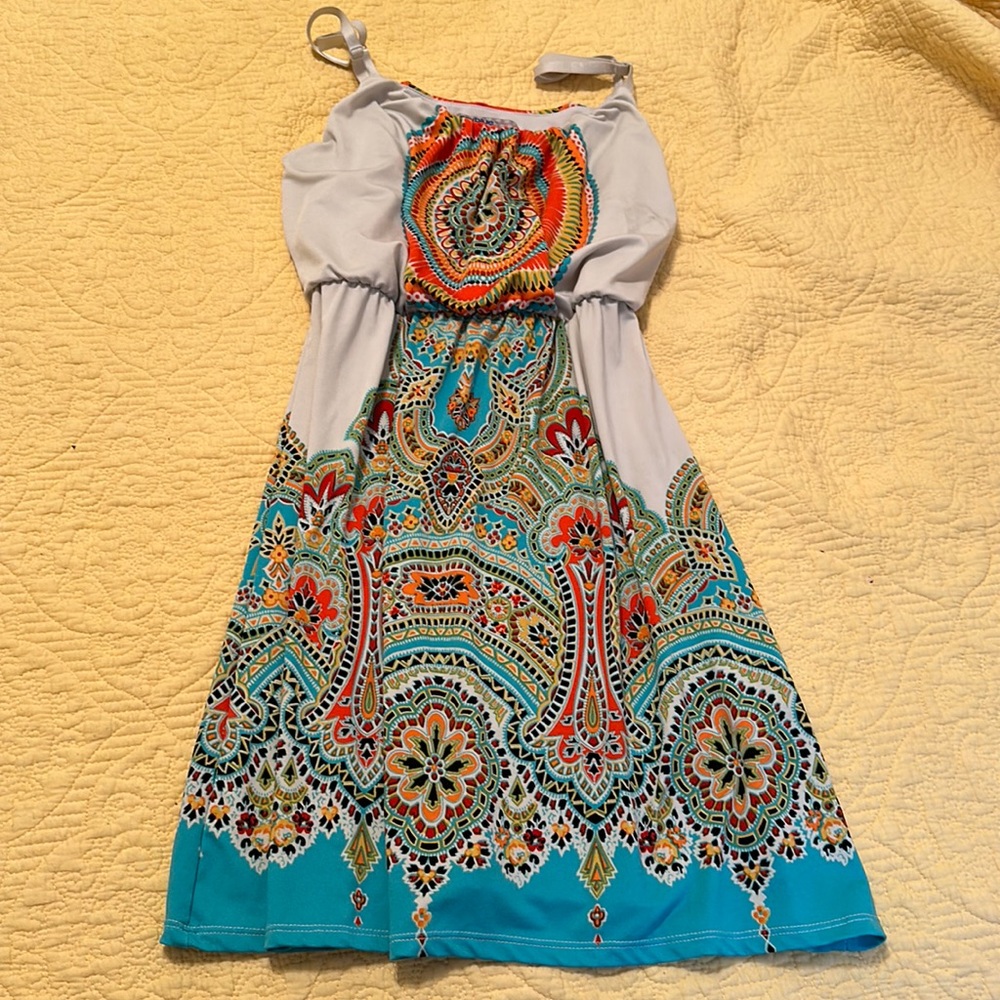 Multicolor, stain glass look. Mini dress with thin straps.